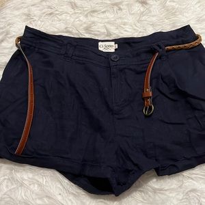 Navy blue shorts with brown belt